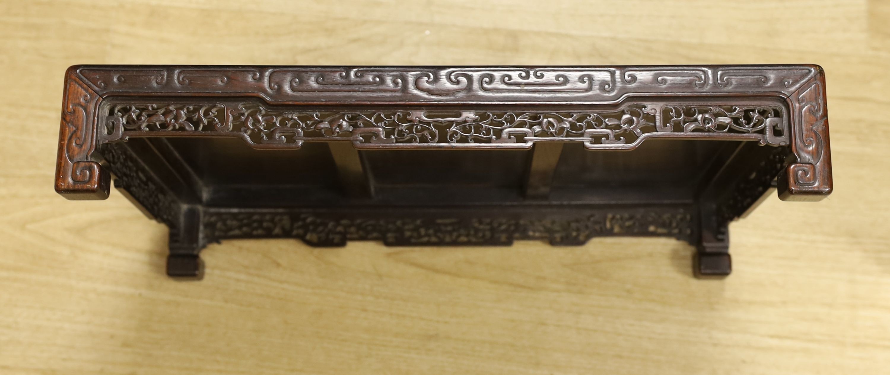 A 19th century Chinese hongmu low stand - 51cm long